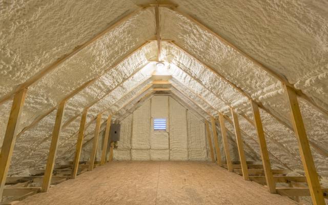 Finished attic with spray foam on the roof deck and gables